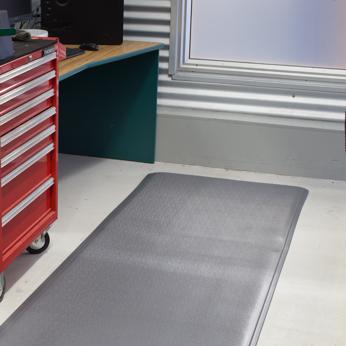 Grey vinyl mat in work area 